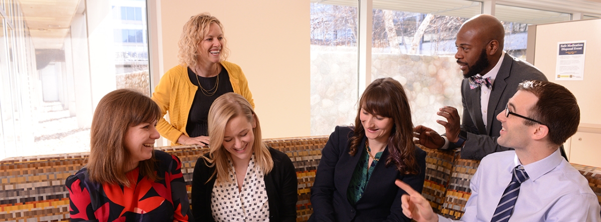 people sitting and talking in a group