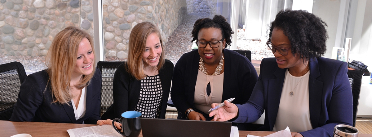 four women sitting at a table