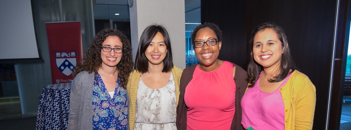 four women standing for a photo
